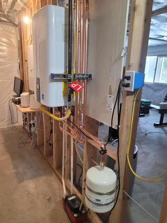 Licensed plumber repairing a kitchen sink in Oakton