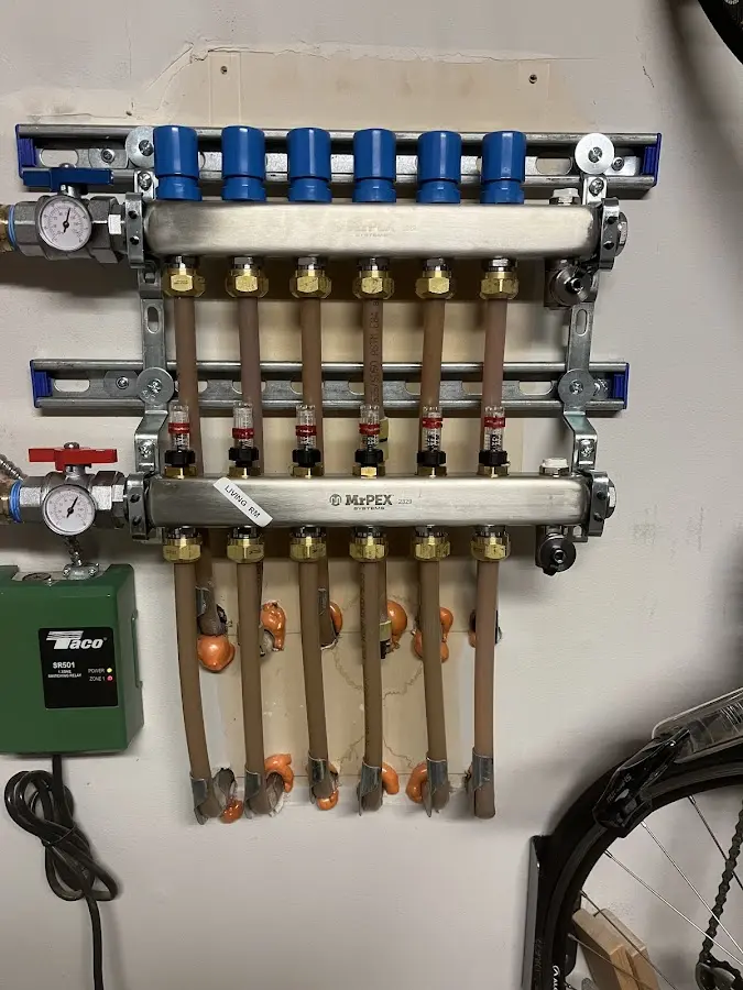 Plumber performing Water Heater Repair at a residential property in Oakton